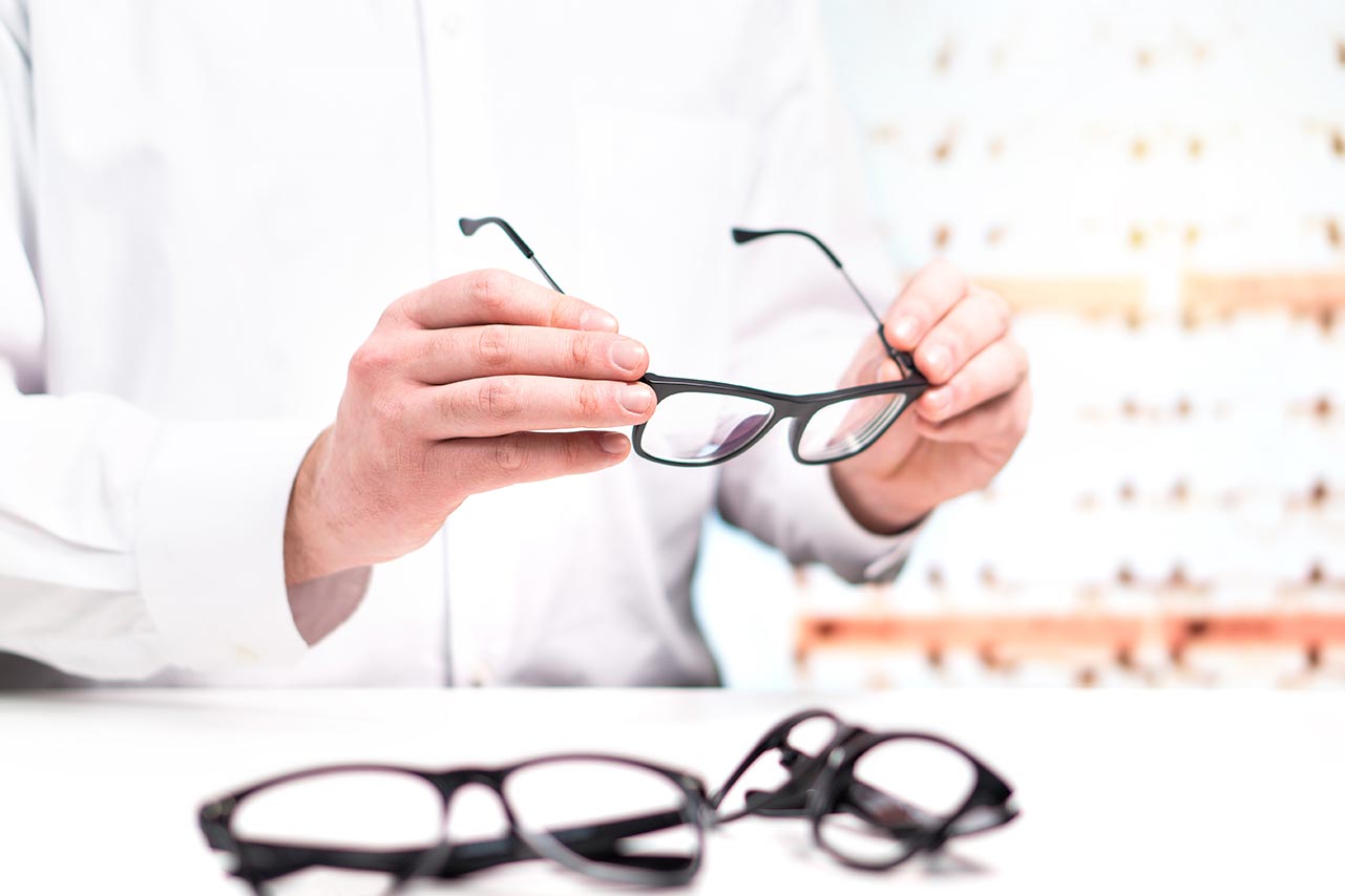 checking a pair of eyeglasses